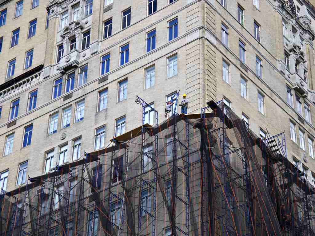 Local Law 11, also known as the Façade Inspection & Safety Program (FISP), is a New York City regulation that requires buildings over six stories to undergo exterior wall inspections every five years. The law aims to ensure public safety by identifying and repairing unsafe façade conditions. Inspections must be conducted by a Qualified Exterior Wall Inspector (QEWI), such as a licensed architect or engineer. Building conditions are classified as Safe, Unsafe, or Safe with a Repair and Maintenance Program (SWARMP). Property owners must file reports with the NYC Department of Buildings and complete any required repairs within strict deadlines. Non-compliance can result in hefty fines and legal penalties.